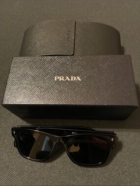 Prada Black PR A17S
Color: 16K-731 Black / Dark Grey Lens
Size: 54-19-150